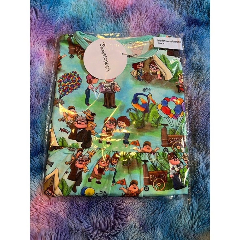 V55. Showstoppers UP the greatest‎ adventure peplum short set 4T NIB